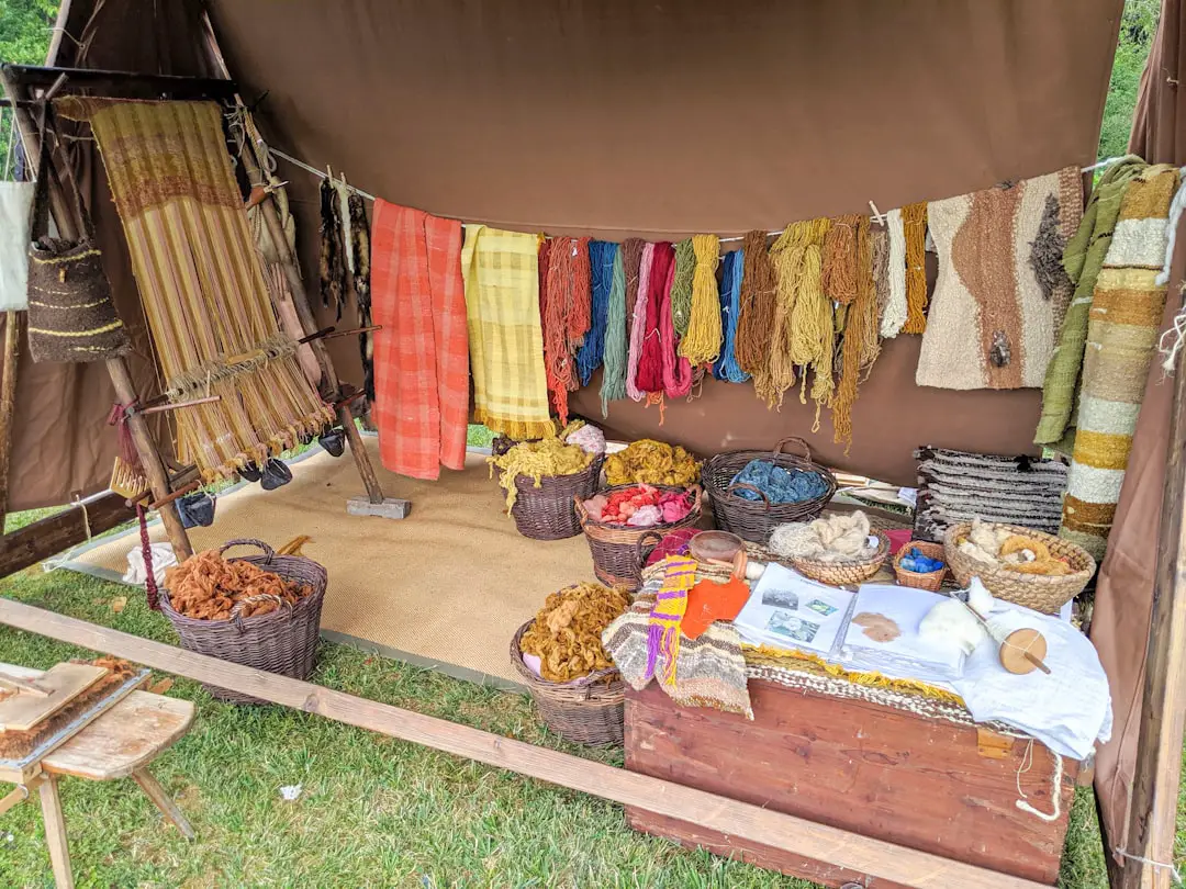 assorted color textiles on brown wooden table