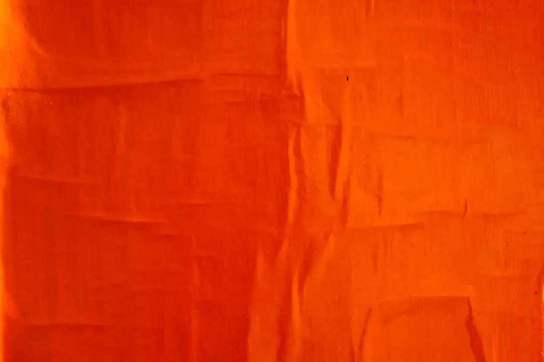 orange textile on white textile