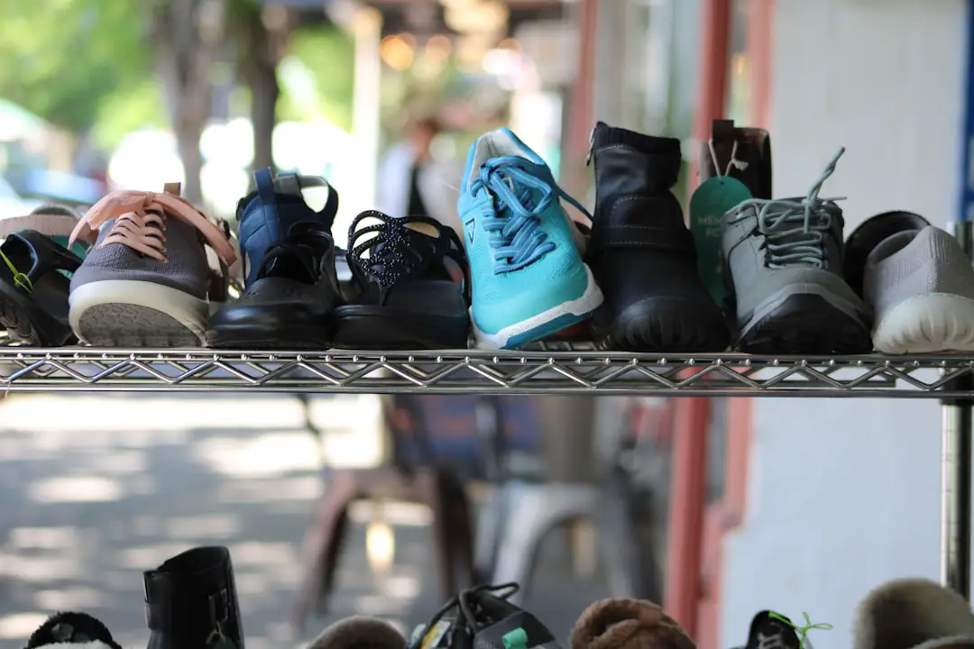 a bunch of shoes that are on a shelf