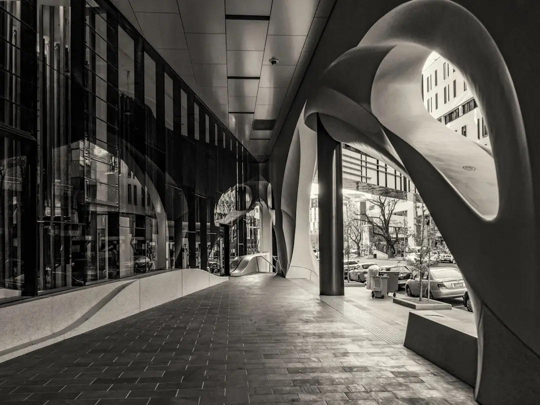 Architecture Buildings by Shoe Brands grayscale photo of people walking on sidewalk