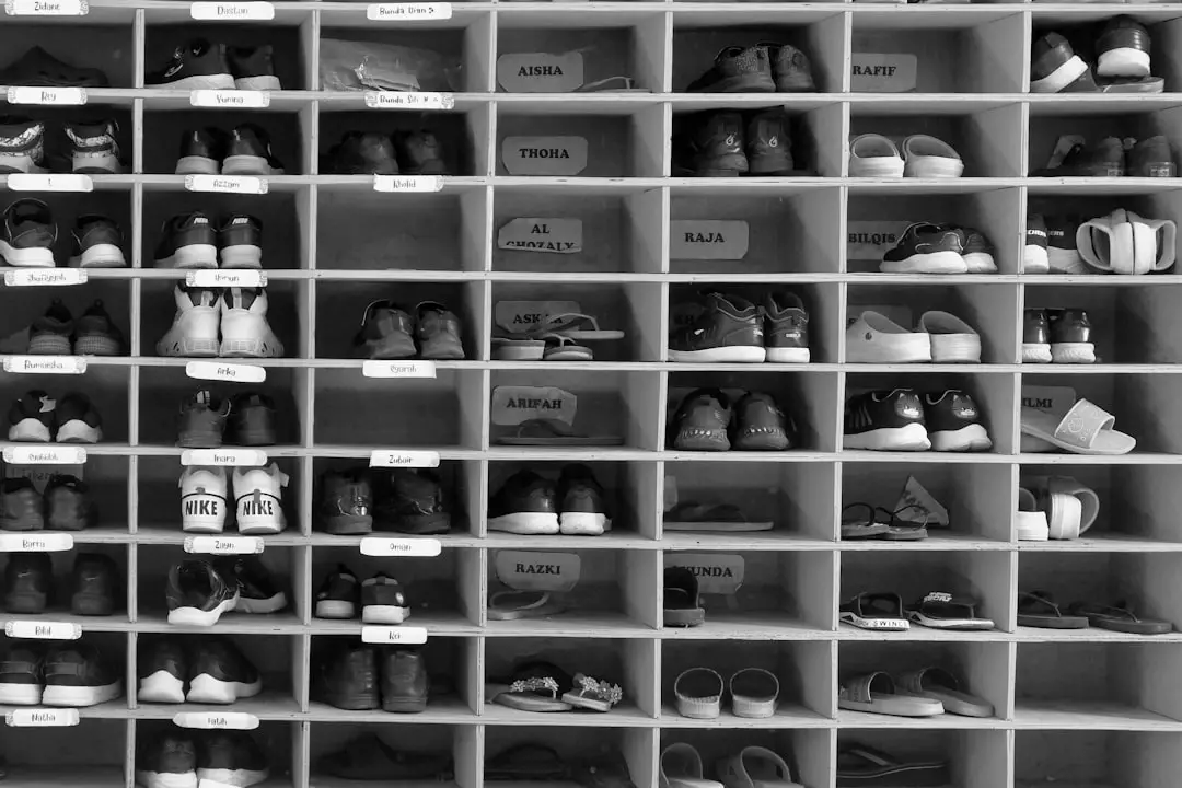Famous footwear companies by Shoe Brands A shelf filled with lots of pairs of shoes